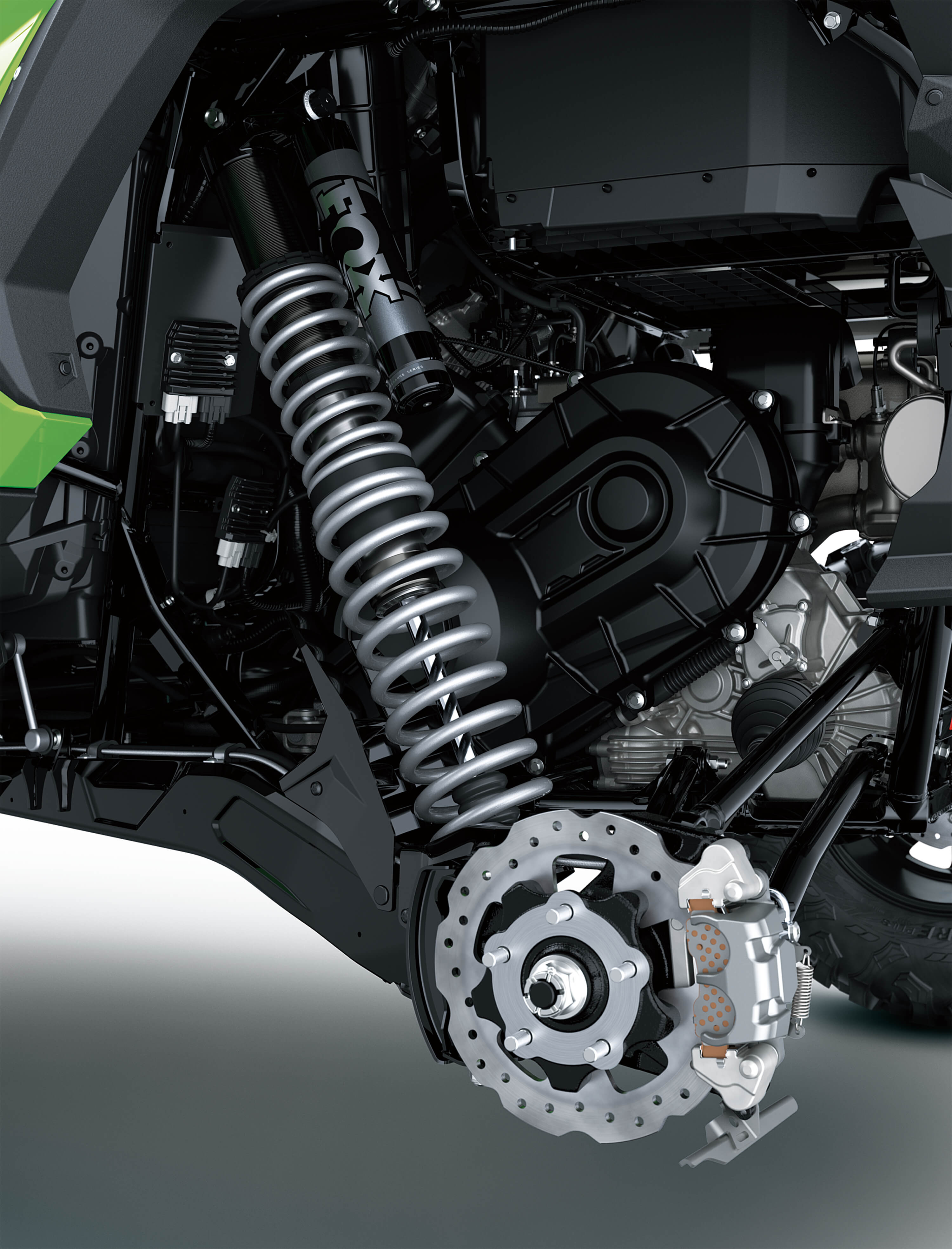 Another close-up of suspension of a side x side in a white studio background.