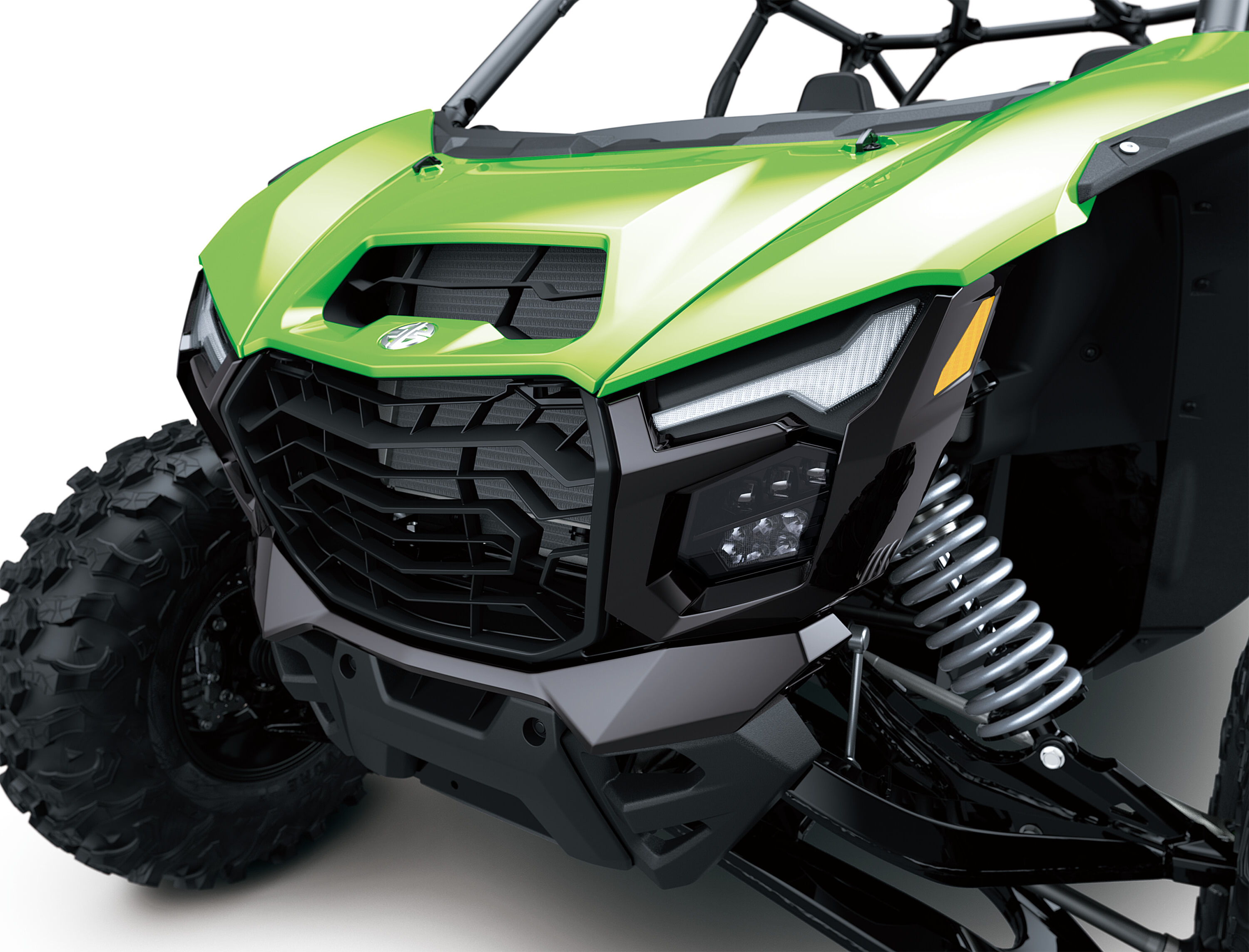 Close-up front three-quarter of the front end of a side x side in a white studio background.