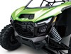 Close-up front three-quarter of the front end of a side x side in a white studio background.