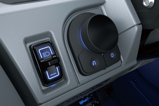 Close-up of interior controls on a side x side in a white studio background. opens in a new window