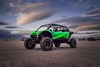 Three-quarter front angle of a side x side off-road.