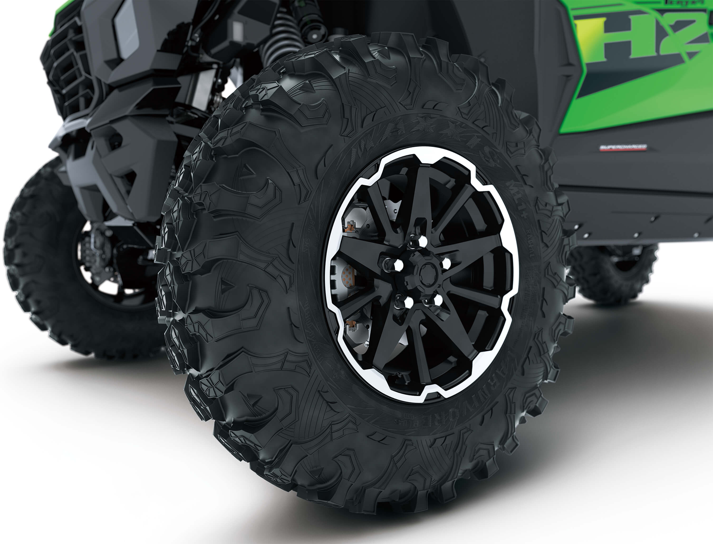 Close-up of wheels of a side x side in a white studio background.