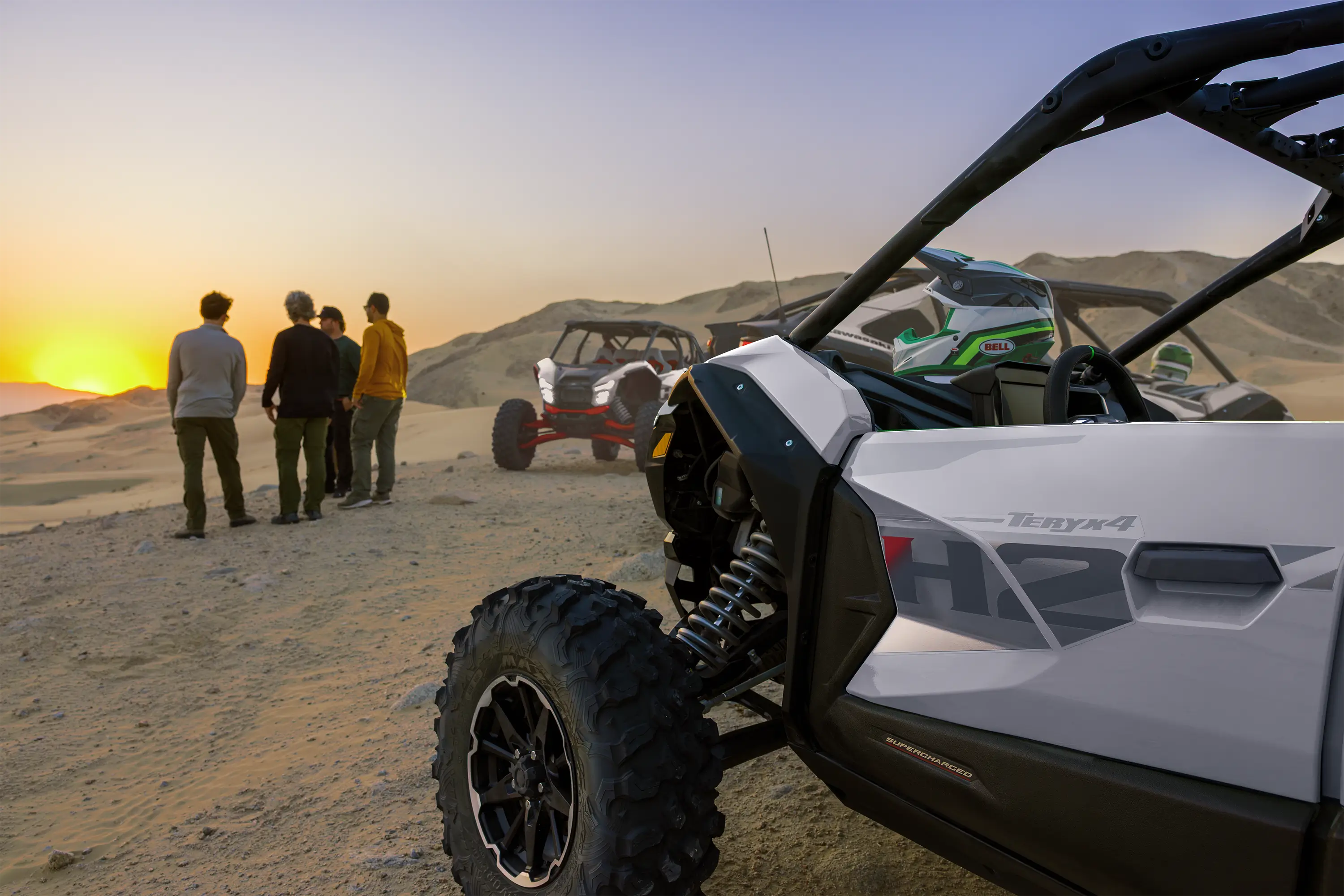 Close-up of the driver's side of a side x side parked on a hill.
