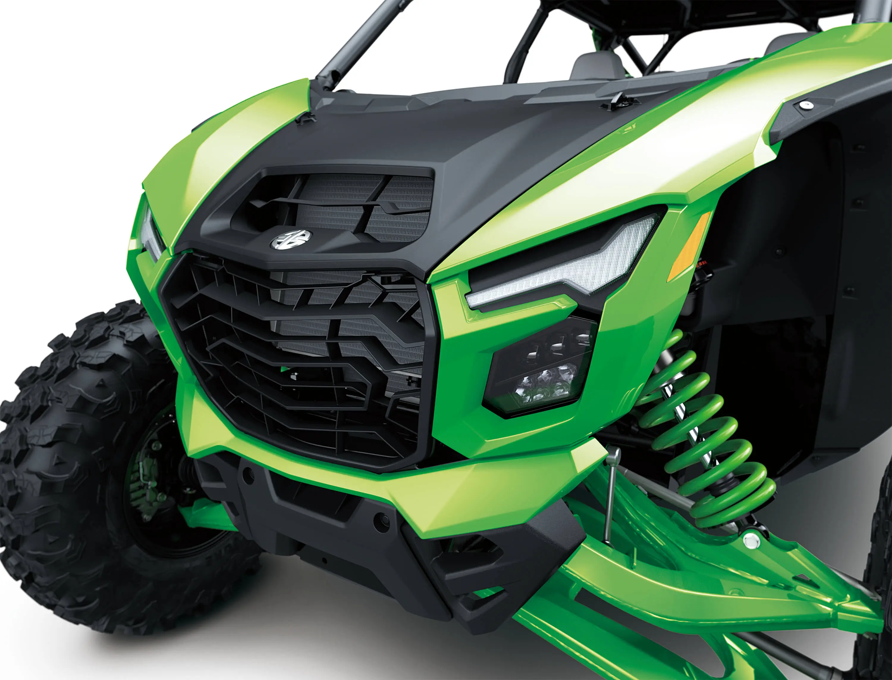 Close-up front three-quarter of the front end of a side x side in a white studio background.