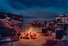 Night camping with side x side in the background.