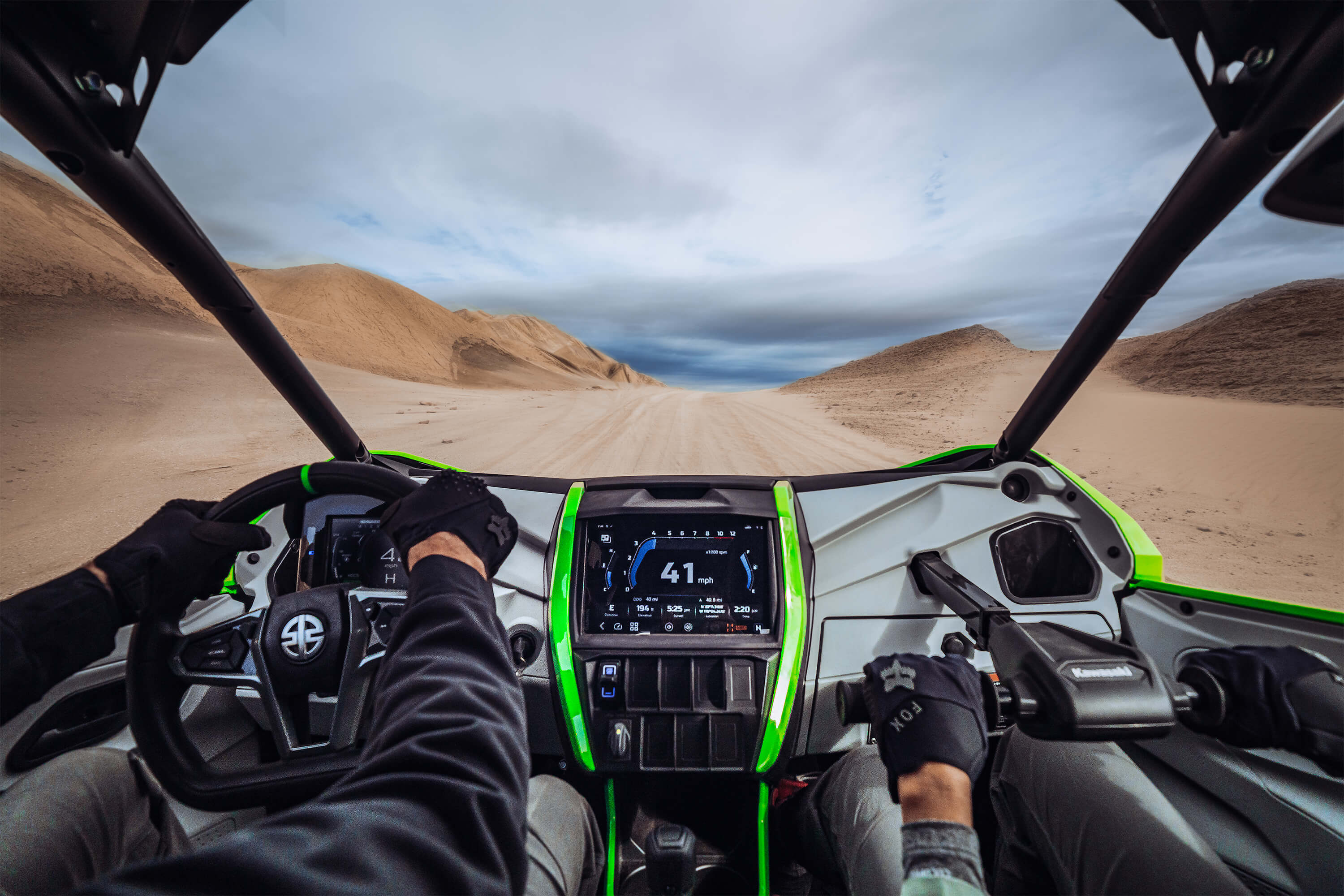 Person POV driving a side x side off-road.