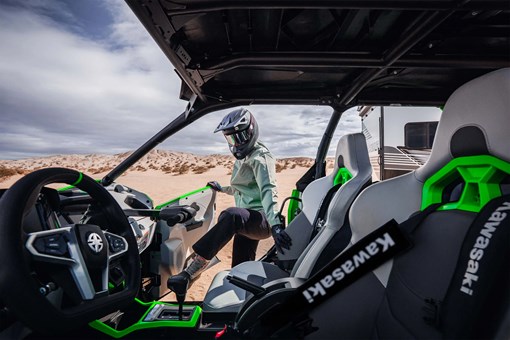 Passenger getting in a side x side off-road. opens in a new window
