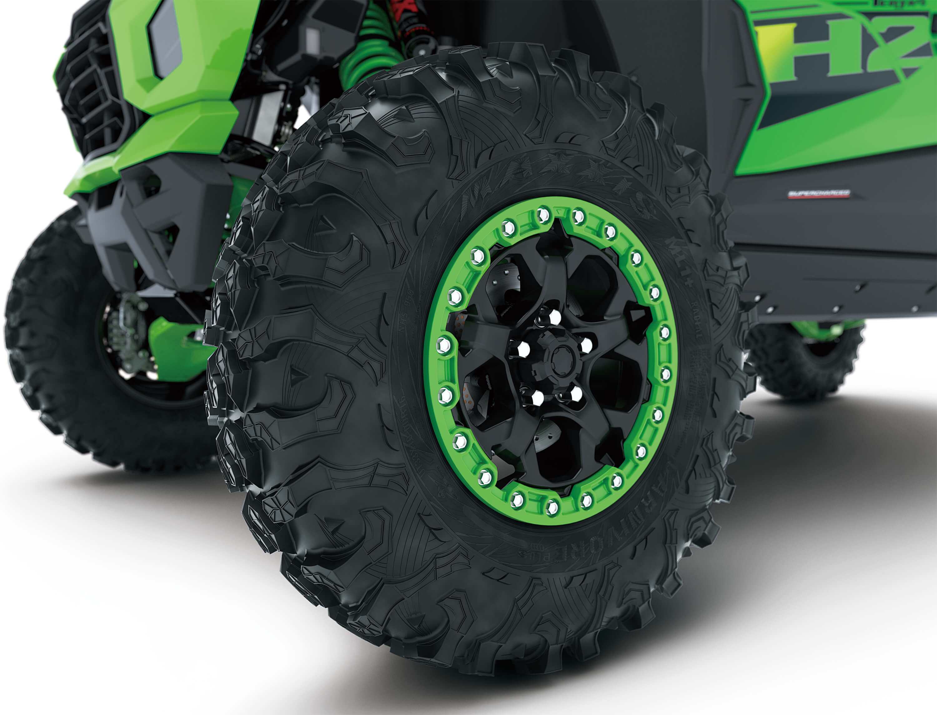 Close-up of wheels of a side x side in a white studio background.