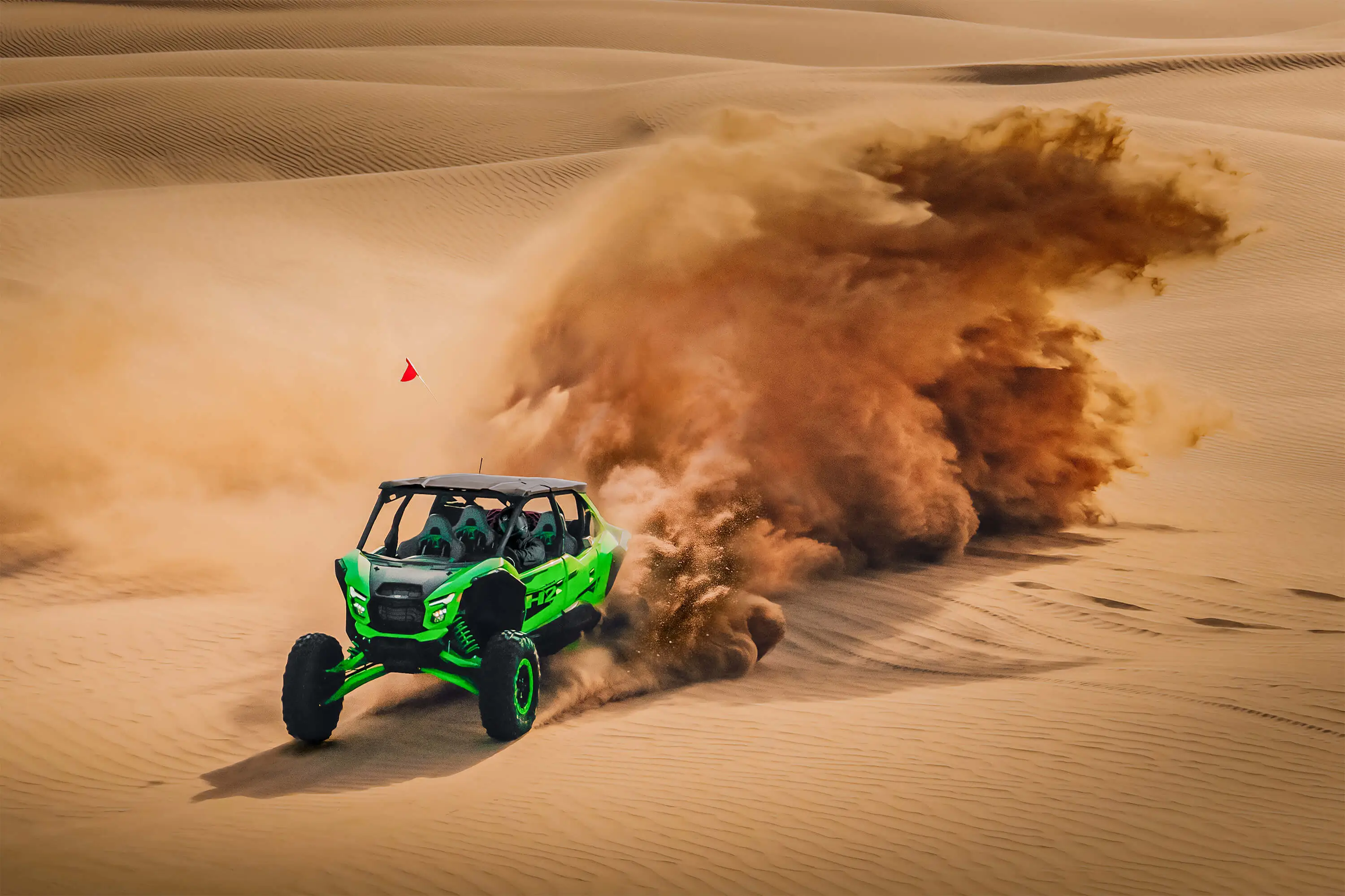Overhead front angle of a person driving a side x side off-road.