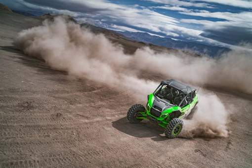 Overhead angle of a person driving a side x side off-road. opens in a new window
