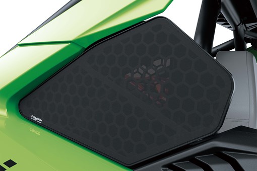 Close-up of a music speaker on a side x side in a white studio background. opens in a new window