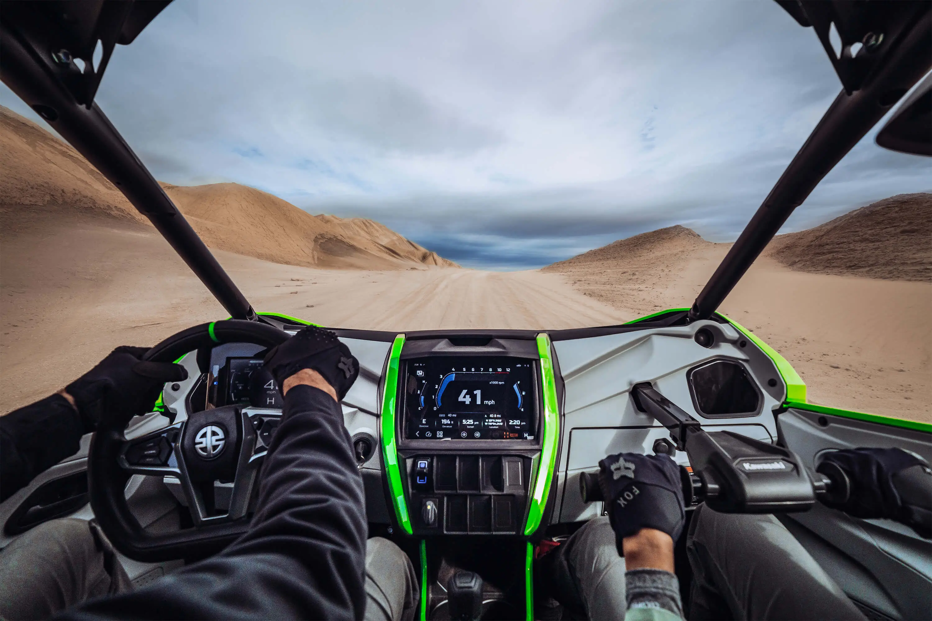 Person POV driving a side x side off-road.