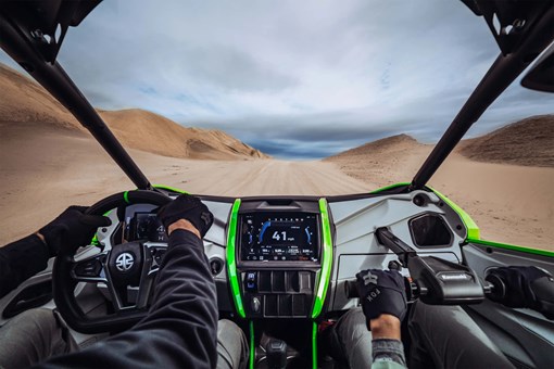 Person POV driving a side x side off-road. opens in a new window