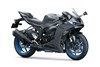 Three-quarter front angle of a gray motorcycle staged in a white studio background.