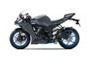 Profile angle of a gray motorcycle staged in a white studio background.