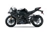 Side angle of a black motorcycle staged in a white studio background.