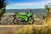 Side angle of a motorcycle staged on a paved path.