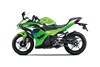 Side angle of a green motorcycle staged in a white studio background.