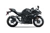 Profile angle of a black motorcycle staged in a white studio background.