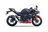 Side angle of a blue motorcycle staged in a white studio background.