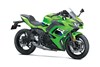 Three-quarter front angle of a green motorcycle staged in a white studio background.
