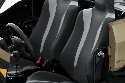 Close-up view of the seats in a side x side staged in a white studio background. opens in a new window