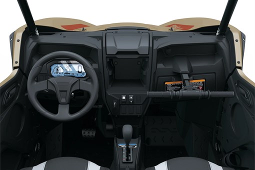 Close-up view of the steering wheel and rider controls in a side x side staged in a white studio background. opens in a new window