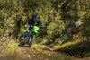 Front angle of a person riding a motorcycle off-road.