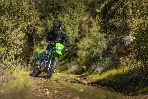 Front angle of a person riding a motorcycle off-road. opens in a new window