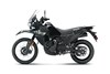 Profile angle of a motorcycle staged in a white studio background.