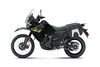 Side angle of a black motorcycle staged in a white studio background.