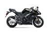 Side angle of a motorcycle staged in a white studio background.