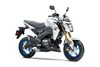 Three-quarter front angle of a white motorcycle staged in a white studio background.