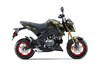 Side angle of a motorcycle staged in a white studio background.