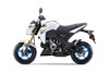 Side angle of a white motorcycle staged in a white studio background.