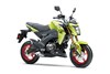 Three-quarter front angle of a green motorcycle staged in a white studio background.