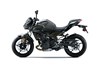 Profile angle of a motorcycle staged in a white studio background.