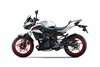 Profile angle of a motorcycle staged in a white studio background.