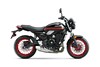 Side angle of a motorcycle staged in a white studio background.