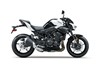 Profile angle of a motorcycle with white accents staged in a white studio background.