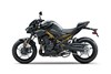 Profile angle of a motorcycle staged in a white studio background.