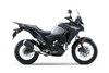 Side angle of a motorcycle staged in a white studio background.