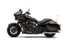 Profile angle of a motorcycle staged in a white studio background.