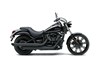 Side angle of a motorcycle staged in a white studio background.