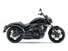 Profile side angle of a motorcycle staged in a white studio background.