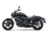 Side profile angle of a motorcycle staged in a white studio background.