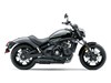 Side angle of a motorcycle staged in a white studio background.