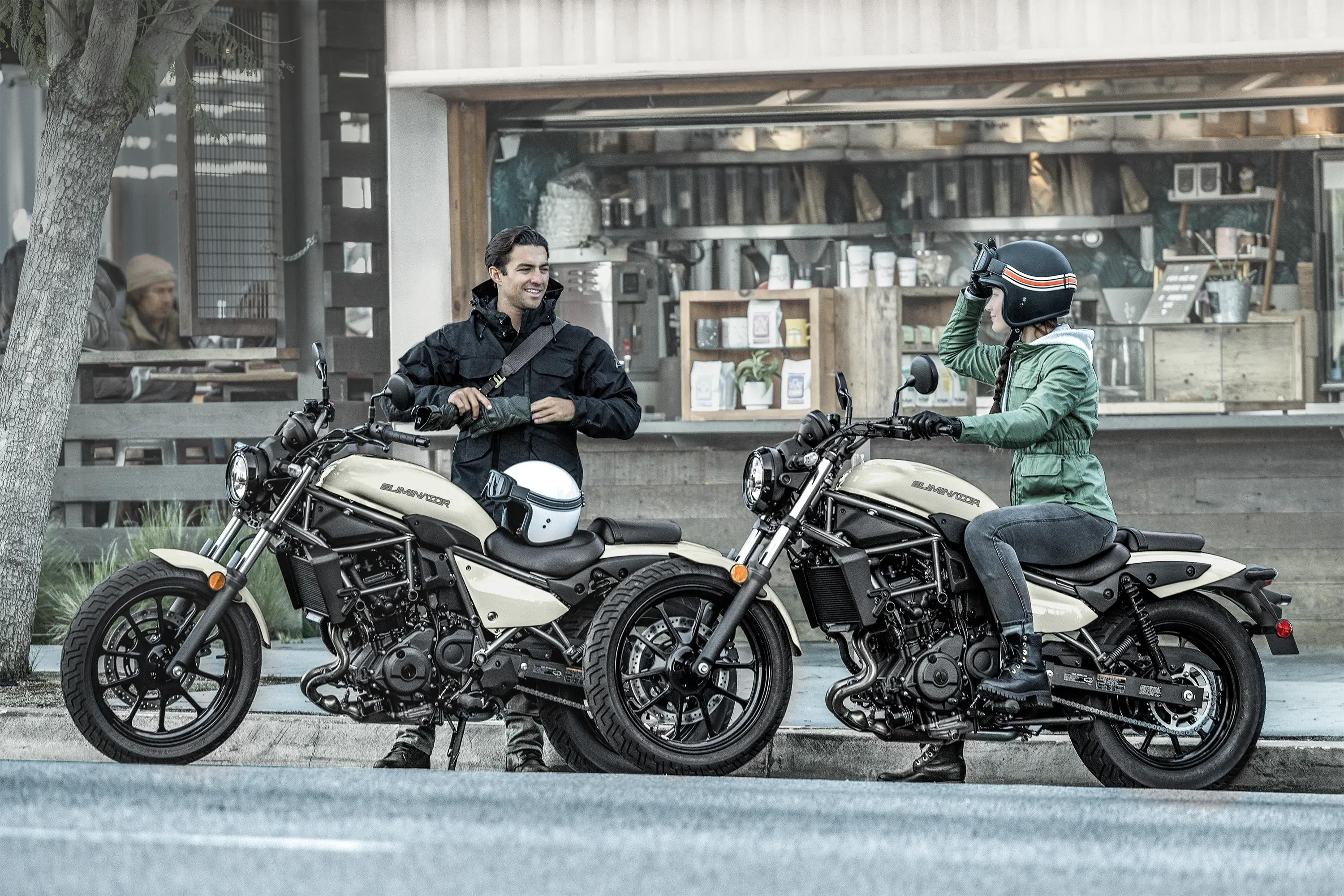 Side angle of two motorcycles parked.