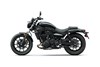 Side profile angle of a motorcycle staged in a white studio background.