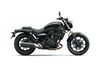 Profile side angle of a motorcycle staged in a white studio background.